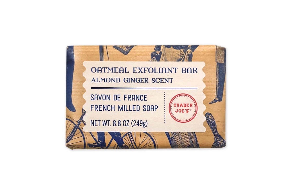 A beige and blue Trader Joe’s oatmeal exfoliant bar soap package labeled "Almond Ginger Scent," "Savon de France," "French Milled Soap," and "Net Wt. 8.8 oz (249g)" with vintage-style illustrations.