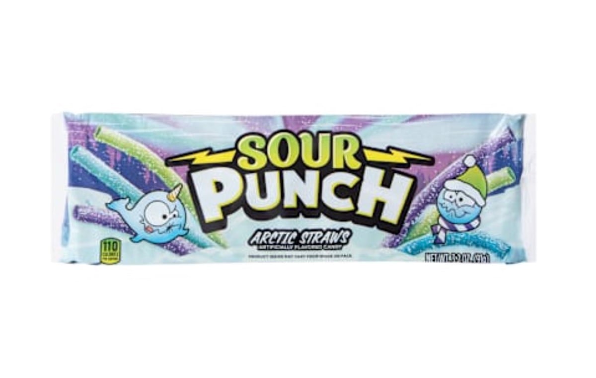 A package of Sour Punch Arctic Straws featuring cartoon images of a narwhal and a Santa Claus. The packaging is blue and purple with yellow accents and multicolored candy straws are shown on the wrapper.