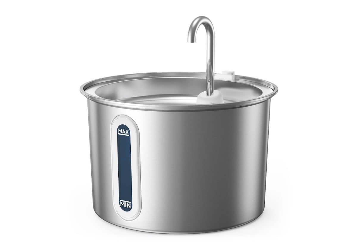 A stainless steel automatic pet water fountain with a spout, showing a transparent water level window marked with “MAX” and “MIN.” The fountain has a modern, cylindrical design.