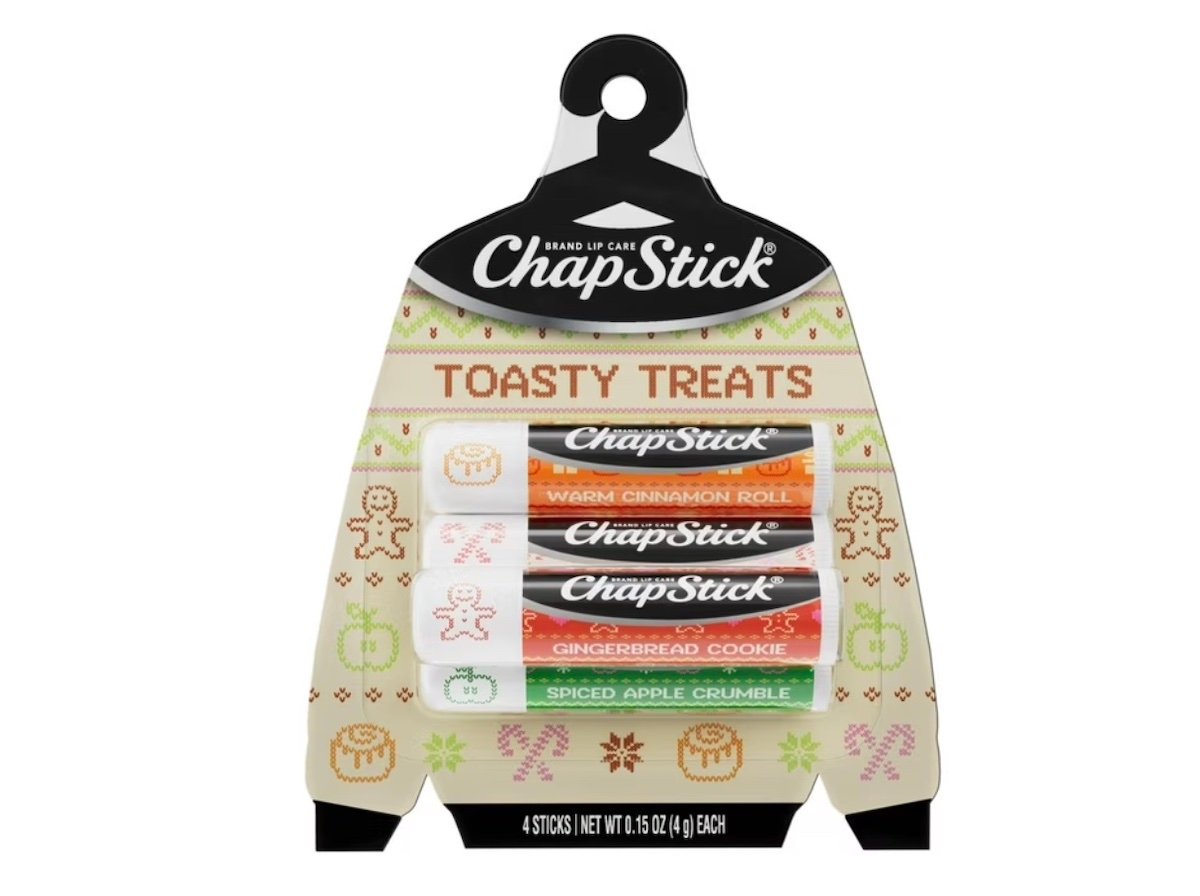 A holiday-themed pack of ChapStick labeled "Toasty Treats," featuring four lip balm sticks in Warm Cinnamon Roll, Caramel Crème, Gingerbread Cookie, and Spiced Apple Crumble flavors, with festive icons on the packaging.