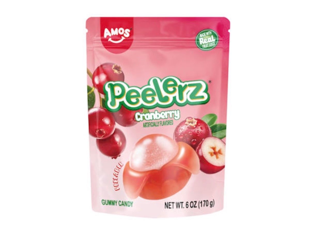 A pink pouch of Amos Peelerz Cranberry gummy candy featuring images of cranberries and a peeled gummy. The packaging states it is artificially flavored and weighs 6 oz (170 g).