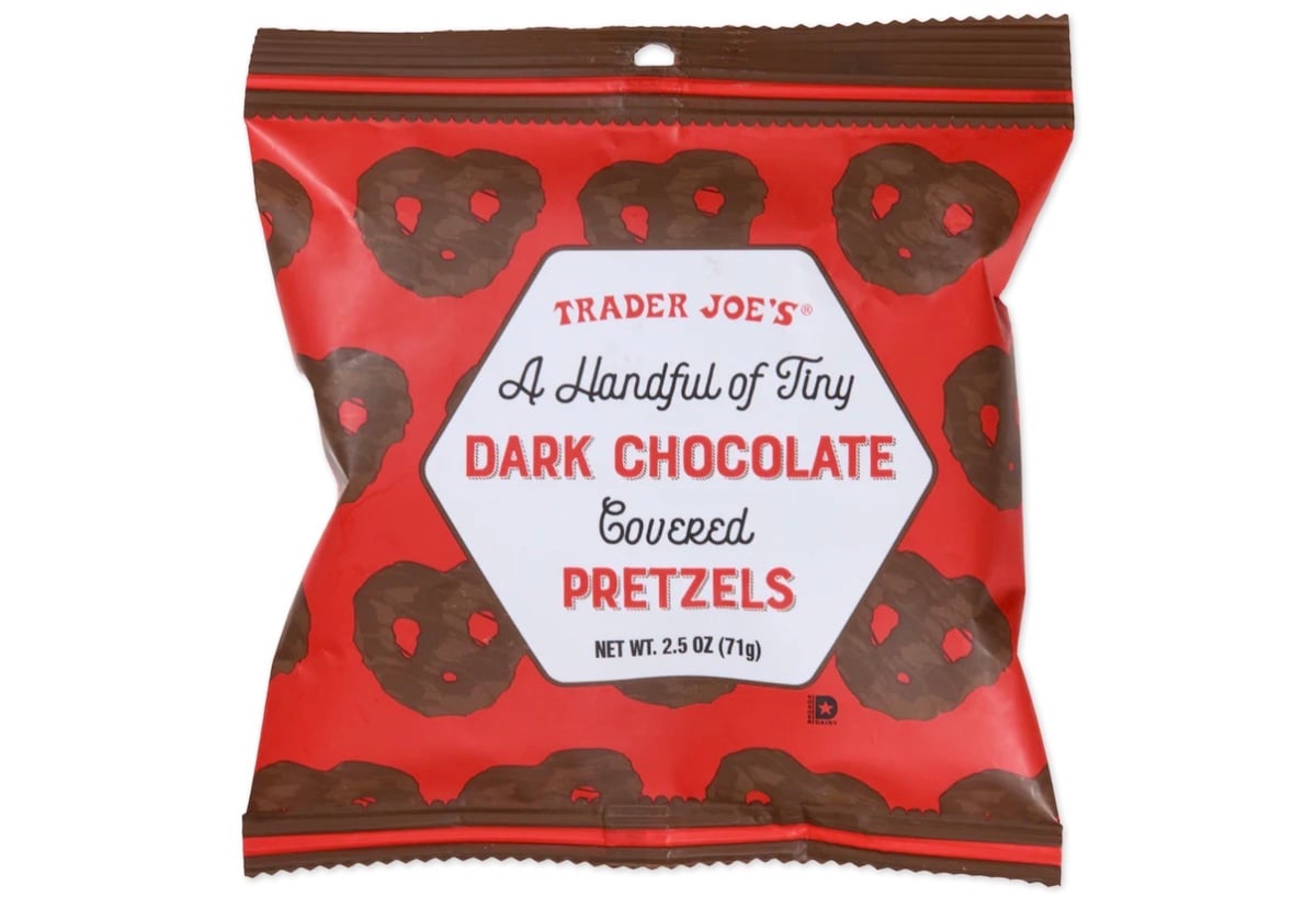 A red and brown package labeled “Trader Joe’s A Handful of Tiny Dark Chocolate Covered Pretzels,” with images of chocolate-covered pretzels on the wrapper. The net weight is 2.5 oz (71g).