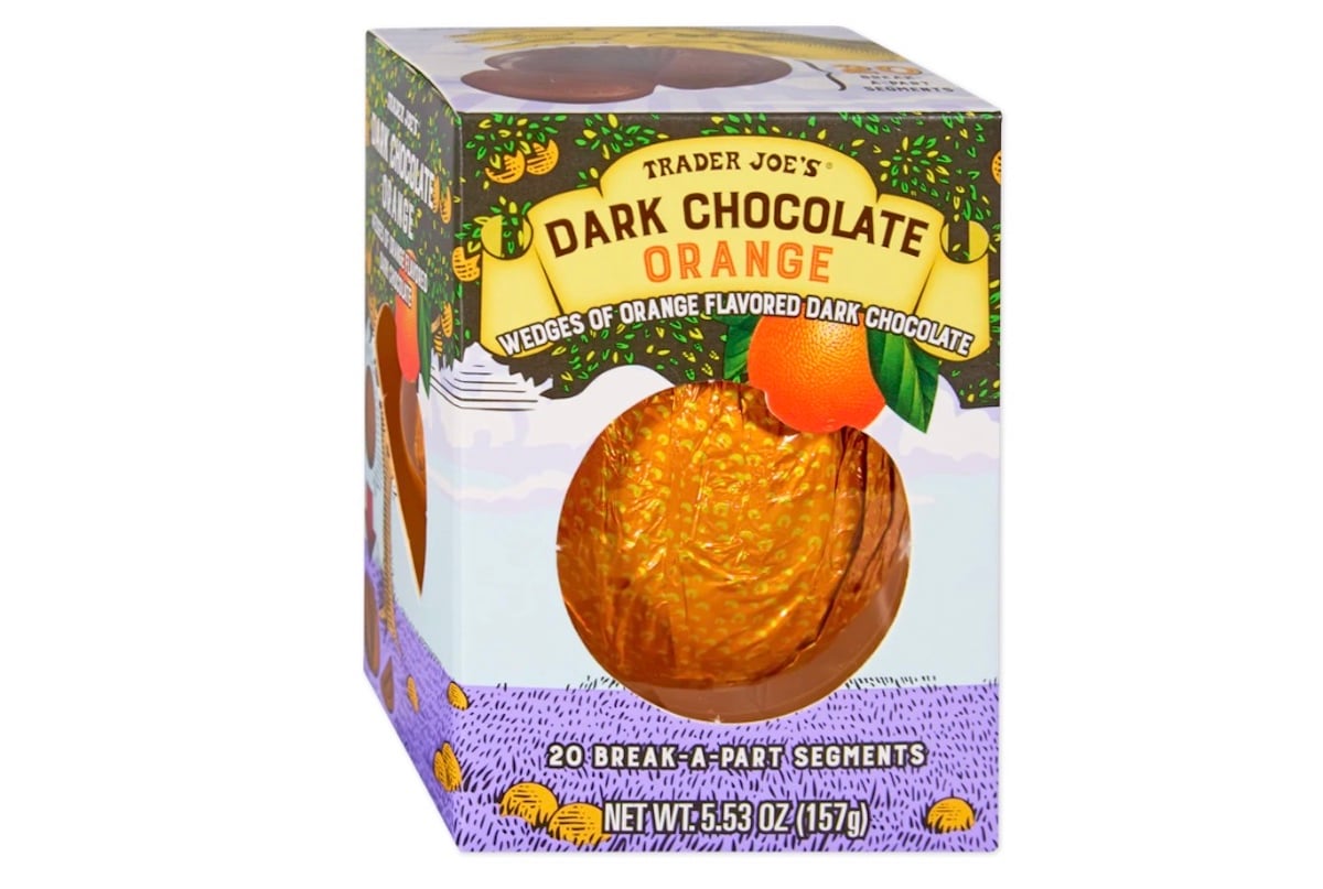 A box of Trader Joe’s Dark Chocolate Orange, showing a round, orange-wrapped chocolate inside. The packaging features illustrations of oranges and advertises 20 break-apart segments, weighing 5.53 oz (157g).