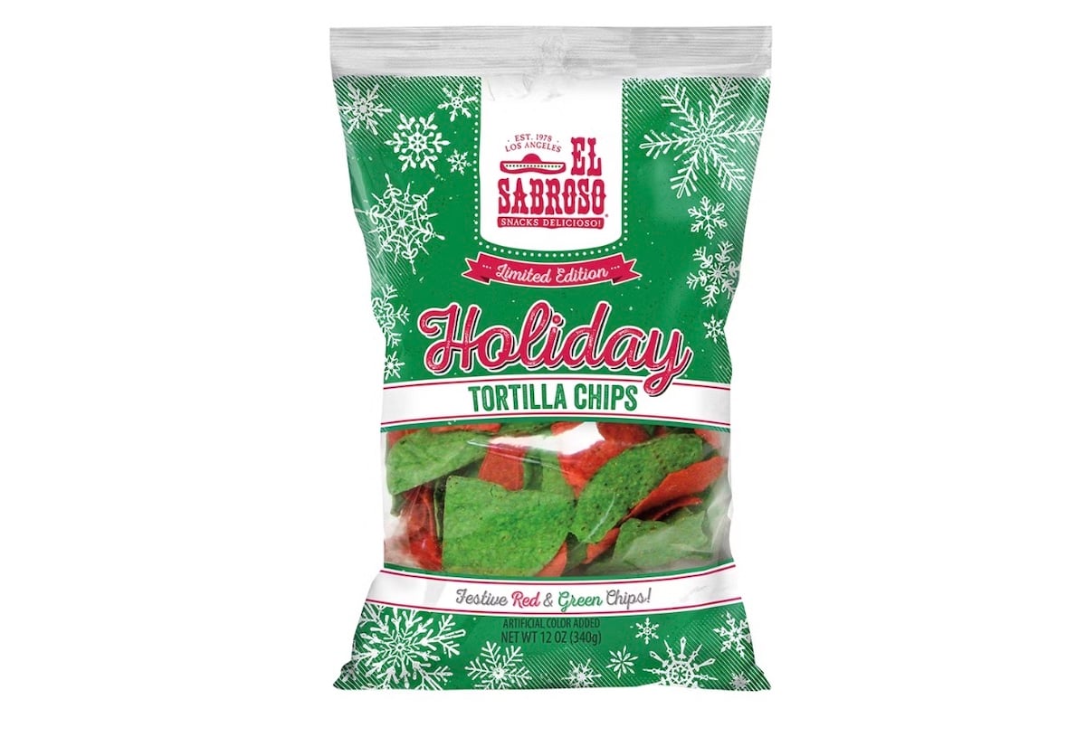 A festive bag of El Sabroso Holiday Tortilla Chips, featuring red and green chips in a clear window. The packaging is green with white snowflakes and red text, labeled "Limited Edition" and "Holiday Tortilla Chips.