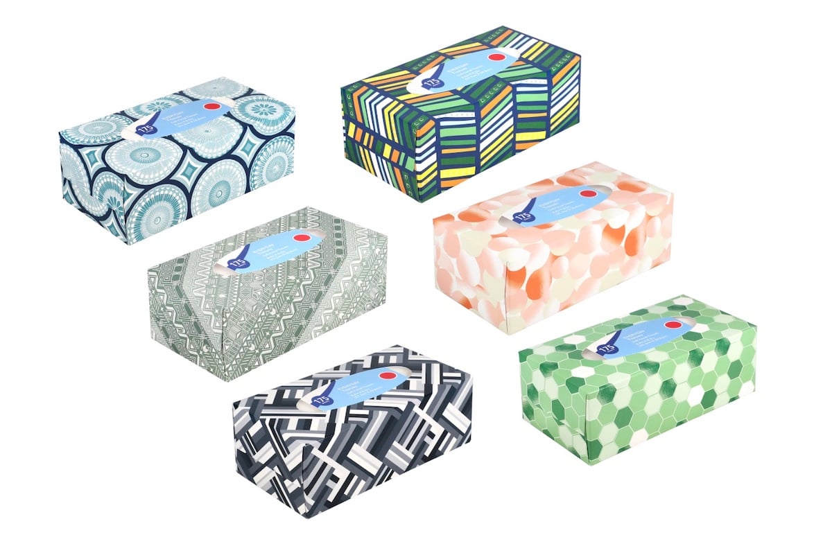 Six rectangular tissue boxes are displayed, each with a unique colorful pattern, including geometric shapes, stripes, circles, and leaf designs in various pastel and bold colors.