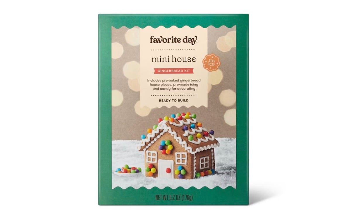 A box of Favorite Day Mini House Gingerbread Kit featuring a decorated gingerbread house with icing and colorful candy on the front. The kit is labeled "Ready to Build" and weighs 6.2 oz.