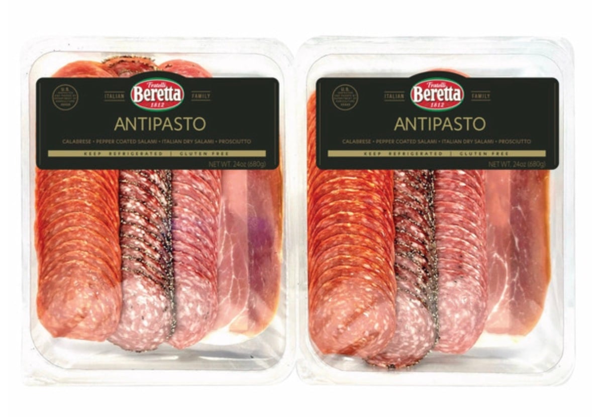 Two plastic packages of Beretta brand Italian antipasto, each containing sliced cured meats including salami and prosciutto, arranged side by side with clear lids and black labels.