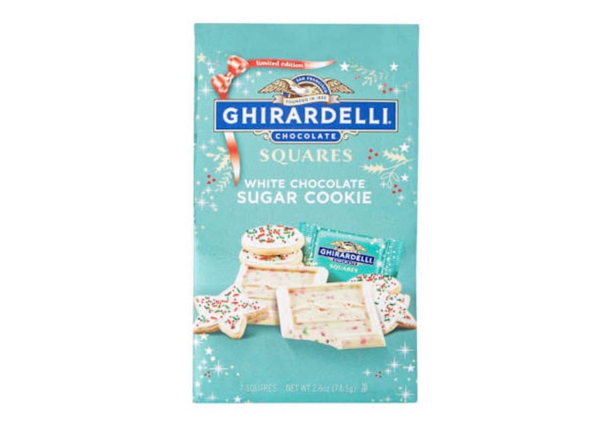 A box of Ghirardelli Squares White Chocolate Sugar Cookie, featuring images of white chocolate squares and decorated sugar cookies on a light blue background with festive holiday designs.