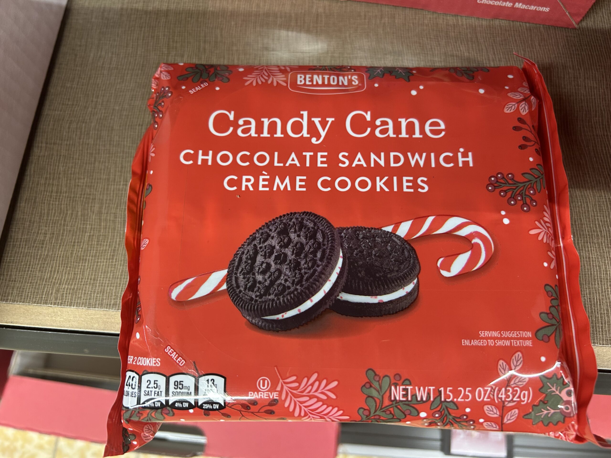 A red package of Benton's Candy Cane Chocolate Sandwich Crème Cookies featuring two cookies with white filling and candy cane graphics. The net weight is 15.25 oz (432g).