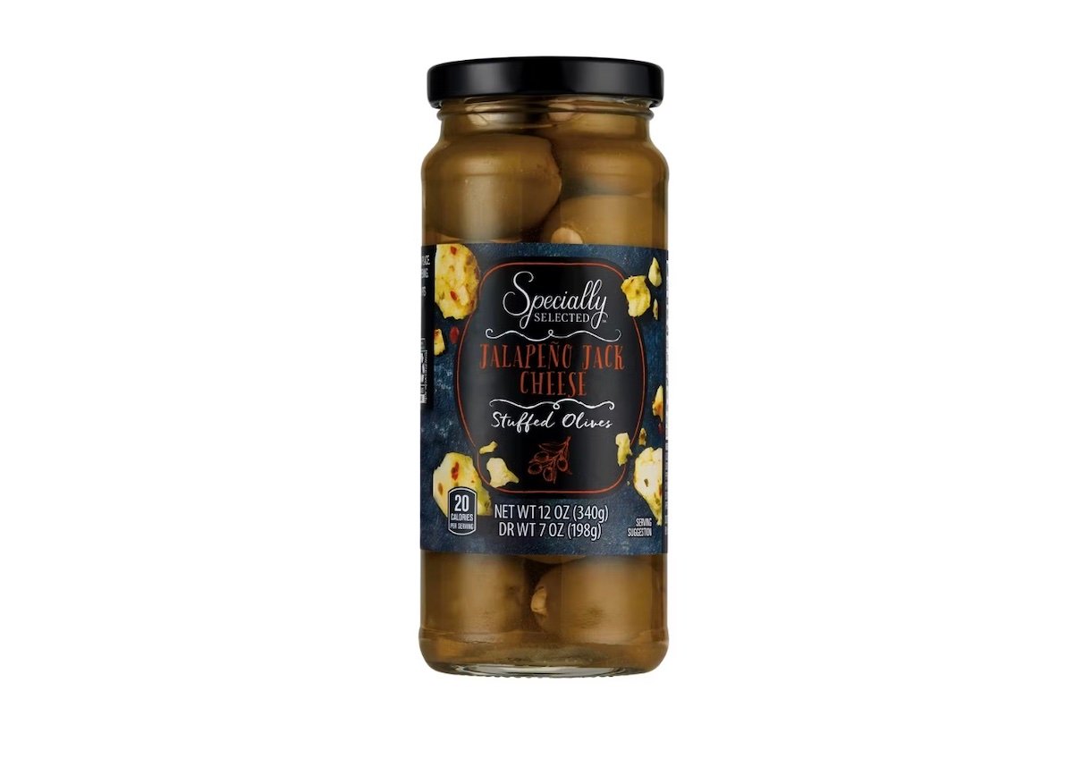 A glass jar of Specially Selected Jalapeno Jack Cheese Stuffed Olives with a black lid and dark label showing olives and cheese pieces. Net weight is 12 oz (340g).