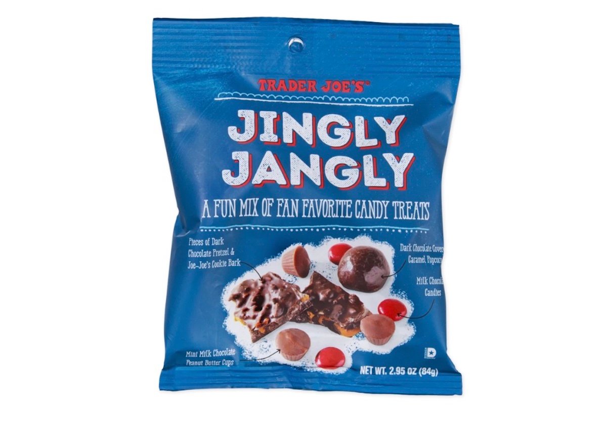 A blue bag of Trader Joe’s Jingly Jangly candy featuring images of assorted chocolate and candy pieces on the front and text describing it as a fun mix of fan favorite candy treats.