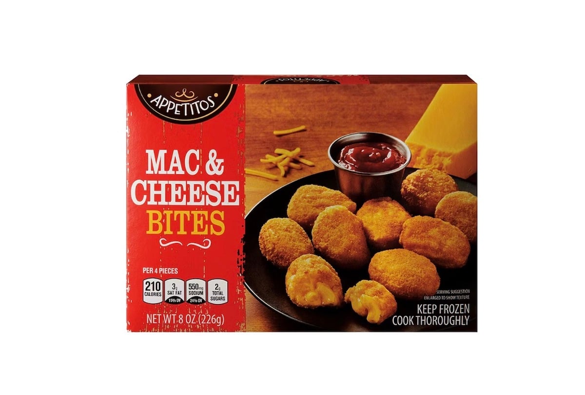 A box of Appetitos Mac & Cheese Bites is shown, featuring a photo of the bites on a black plate with a side of ketchup and a wedge of cheddar cheese. The packaging highlights nutrition facts and cooking instructions.
