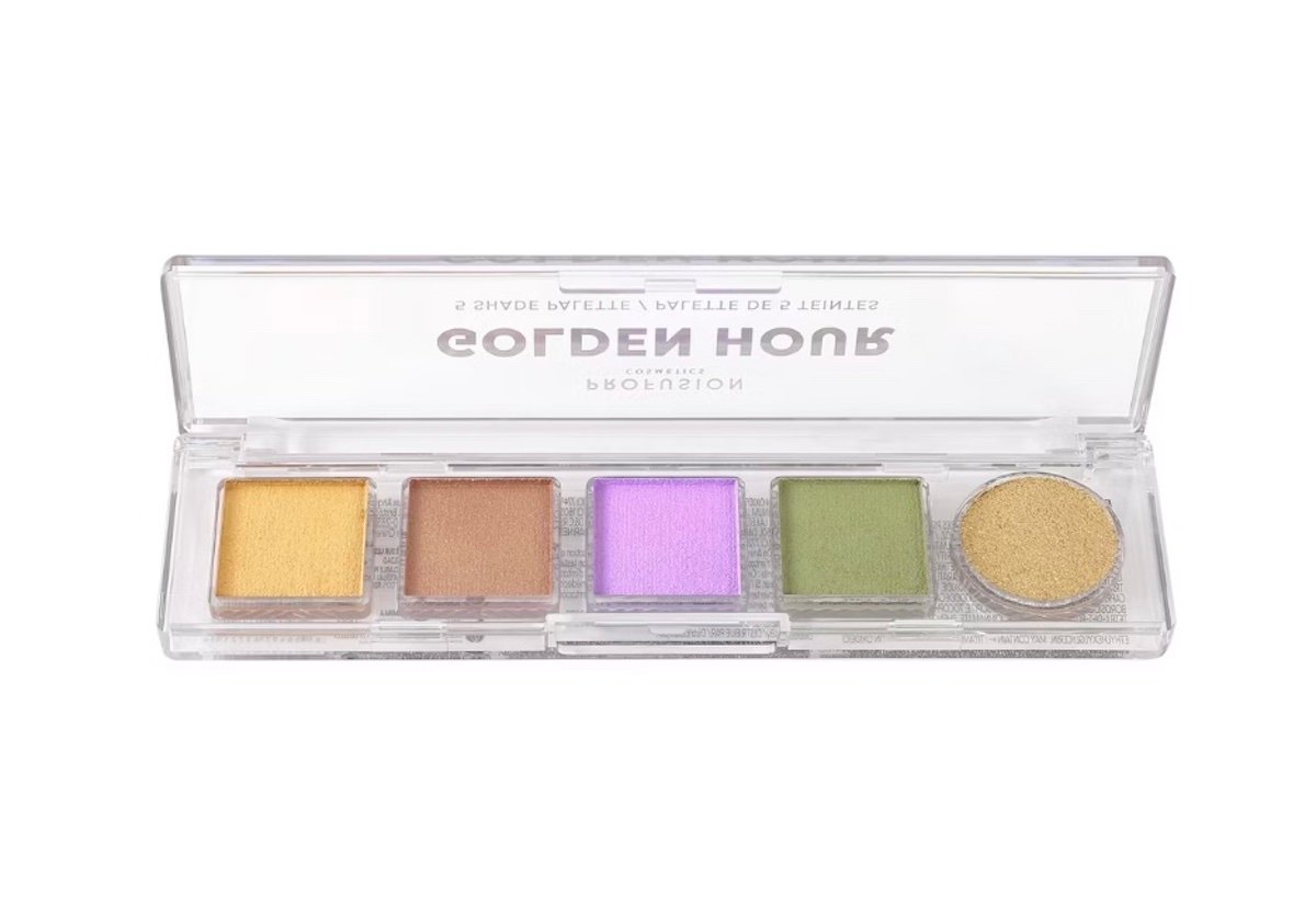 A clear plastic palette containing five shimmery eyeshadows in yellow, bronze, purple, green, and gold shades, labeled "GOLDEN HOUR" on the lid.