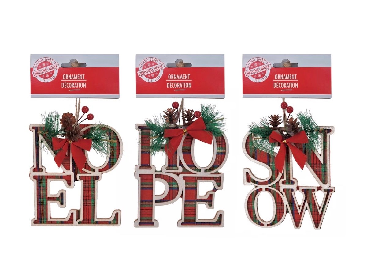 Three plaid Christmas ornament decorations with pine cones, greenery, and red bows. The ornaments spell out "NOEL," "HOPE," and "SNOW" in large letters beneath red packaging labeled "Ornament Decoration.