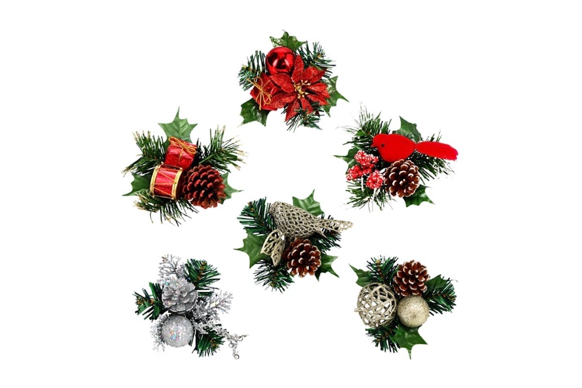 Five festive Christmas decorations made of artificial pine, holly leaves, pinecones, and ornaments. Designs include red bows, a red cardinal, gold and silver ornaments, gift boxes, and berries, all arranged in holiday clusters.