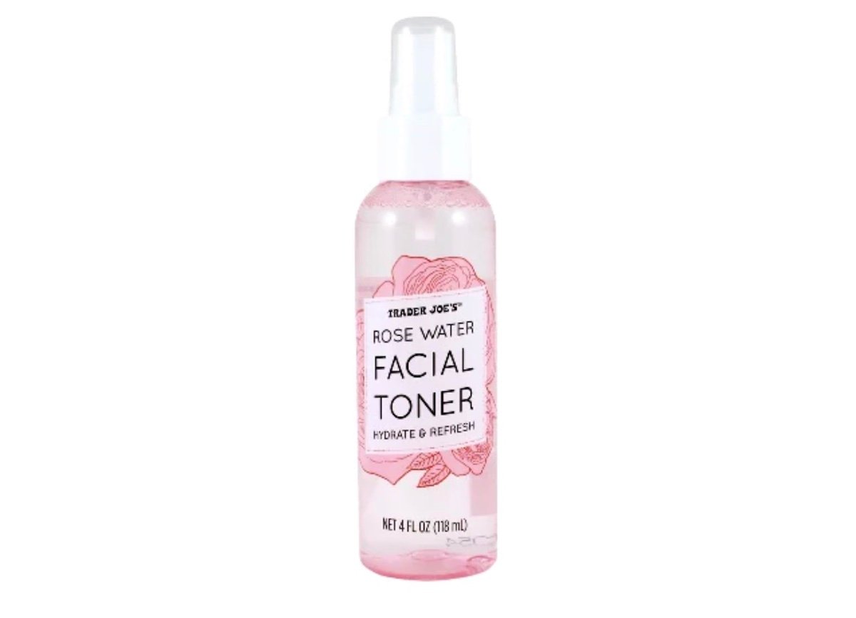 A clear plastic spray bottle labeled "Trader Joe's Rose Water Facial Toner Hydrate & Refresh," containing 4 fl oz (118 ml) of liquid, with a pink floral design on the label.