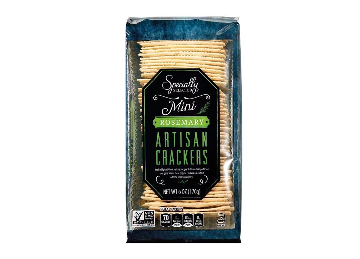 A package of Specially Selected Mini Rosemary Artisan Crackers, 6 oz, with crackers visible through the clear front, displaying nutrition facts and non-GMO, kosher, and recycled packaging symbols at the bottom.