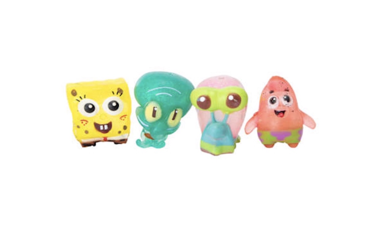 Four colorful toy figurines resembling characters from SpongeBob SquarePants, including a yellow sponge, a turquoise squid, a pink snail, and a pink starfish, all standing in a row against a white background.