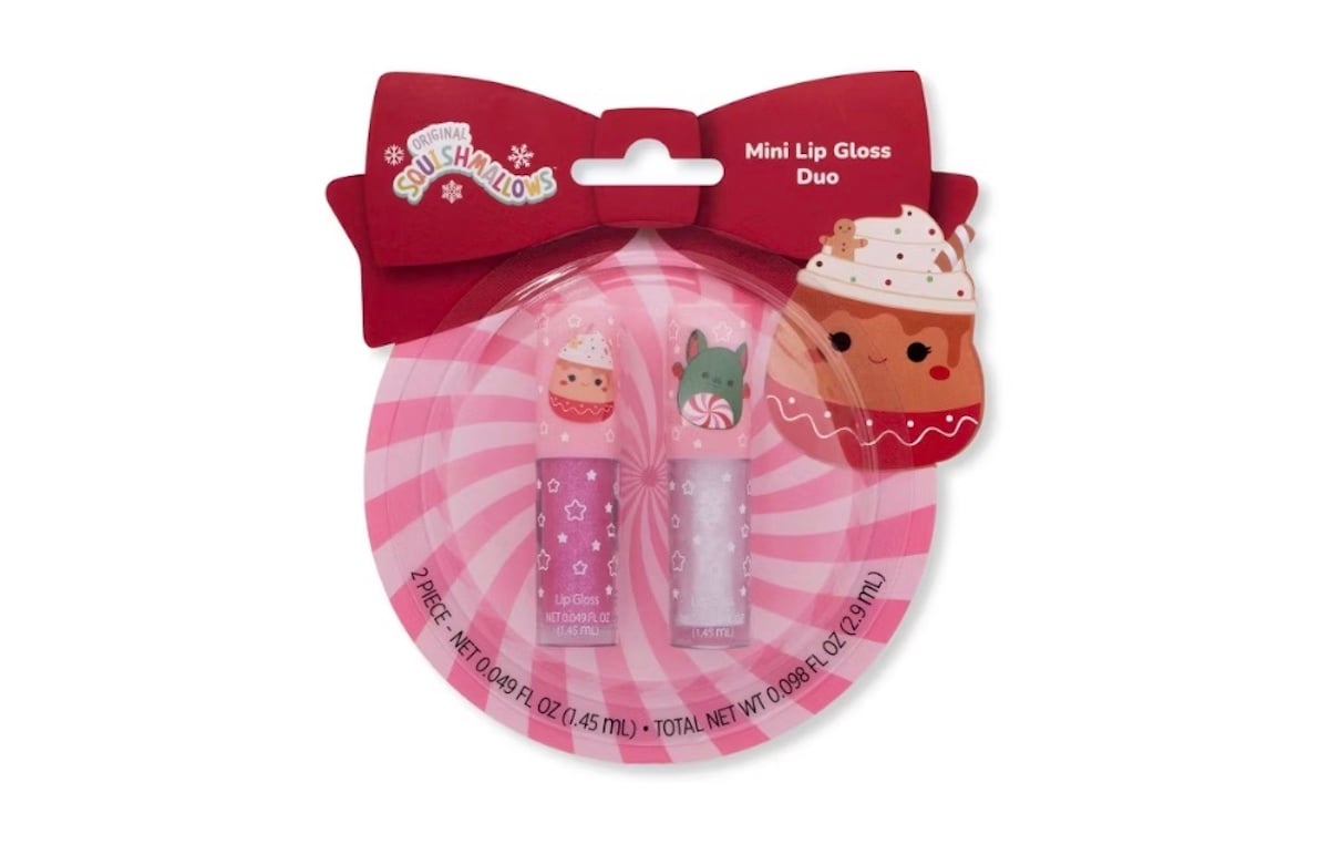 A pack of two Squishmallows mini lip glosses in a pink, round package with a large red bow and cupcake character designs. The lip gloss tubes are pink and clear with cute animal cupcake illustrations.