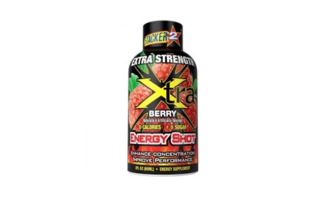 A bottle of Stacker 2 Xtra Energy Shot in berry flavor, featuring a red berry graphic on the label and text highlighting "extra strength," "0 calories," "0 sugar," and "energy supplement.