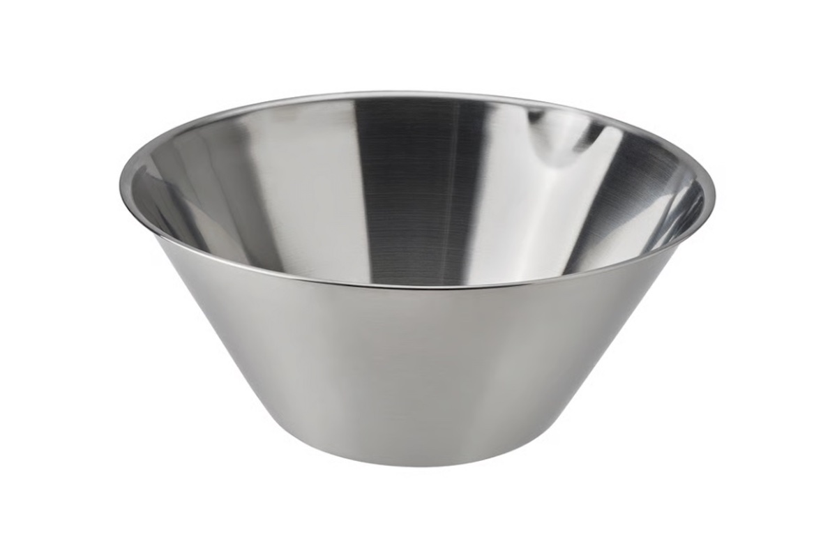 A shiny, stainless steel mixing bowl with sloped sides, shown on a white background.