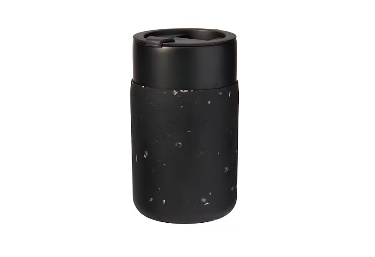 A black insulated travel mug with a speckled pattern and a black lid, shown against a white background.