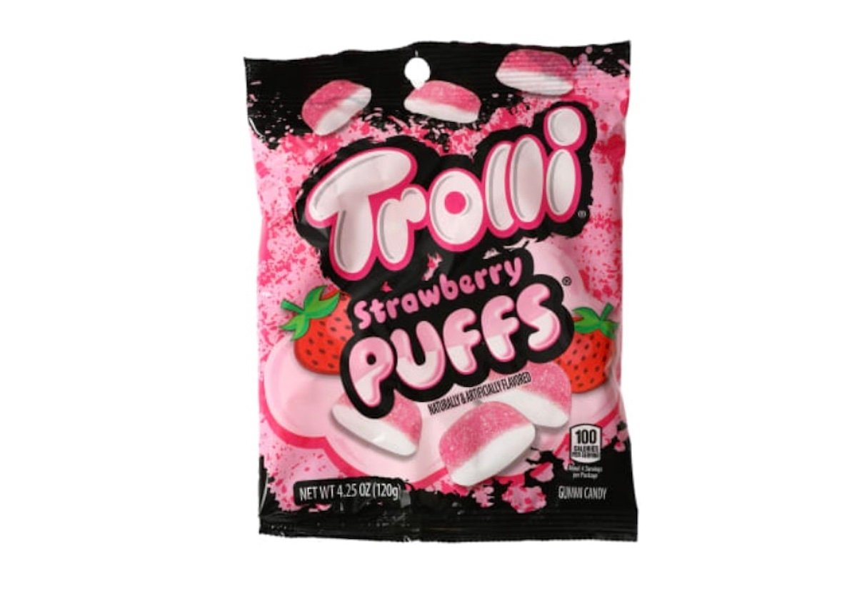 A bag of Trolli Strawberry Puffs gummy candy with a pink and black design, featuring images of the puffs and strawberries. The bag has the text "Strawberry Puffs" and weighs 4.25 oz (120g).