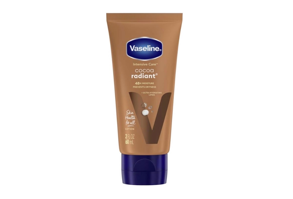 A brown tube of Vaseline Intensive Care Cocoa Radiant lotion with a blue cap, featuring product details and the Vaseline logo on the front.
