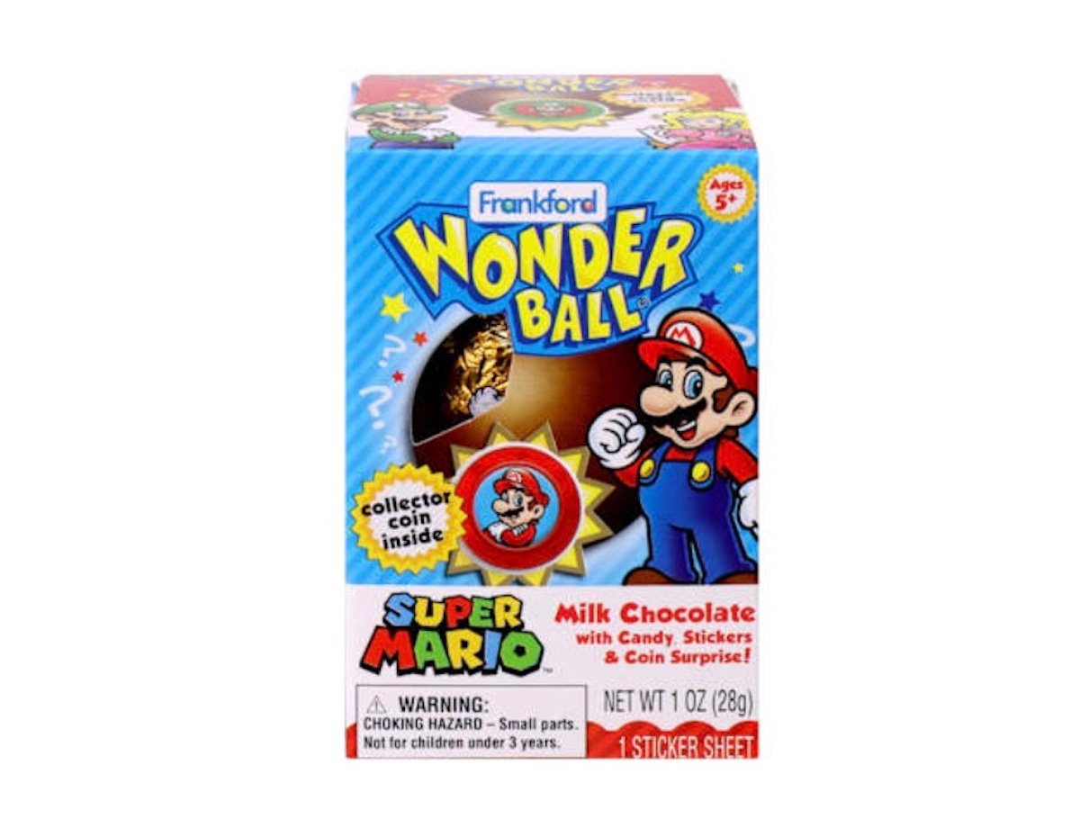 A box of Frankford Wonder Ball featuring Super Mario, containing milk chocolate, candy, stickers, and a collector coin. The packaging shows Mario and has colorful, playful designs. For ages 5 and up.