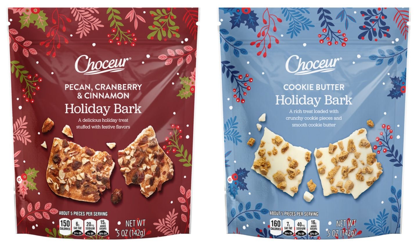 Two bags of Choceur Holiday Bark: one is Pecan, Cranberry & Cinnamon flavor in a red package, and the other is Cookie Butter flavor in a blue package. Both show images of bark pieces with toppings.