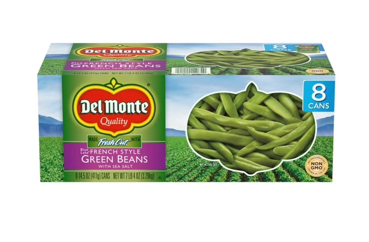 A package of Del Monte French Style Green Beans with Sea Salt, containing 8 cans. The box features an image of green beans, the Del Monte logo, and highlights that the product is non-GMO.