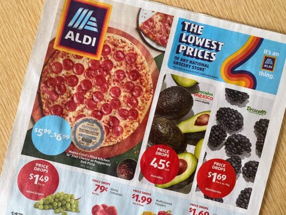 A grocery store flyer from ALDI features an Aldi pizza deal on pepperoni pizza, plus avocados, blackberries, green grapes, Roma tomatoes, and mini sweet peppers with colorful price tags and a banner reading "THE LOWEST PRICES OF ANY NATIONAL GROCERY STORE.