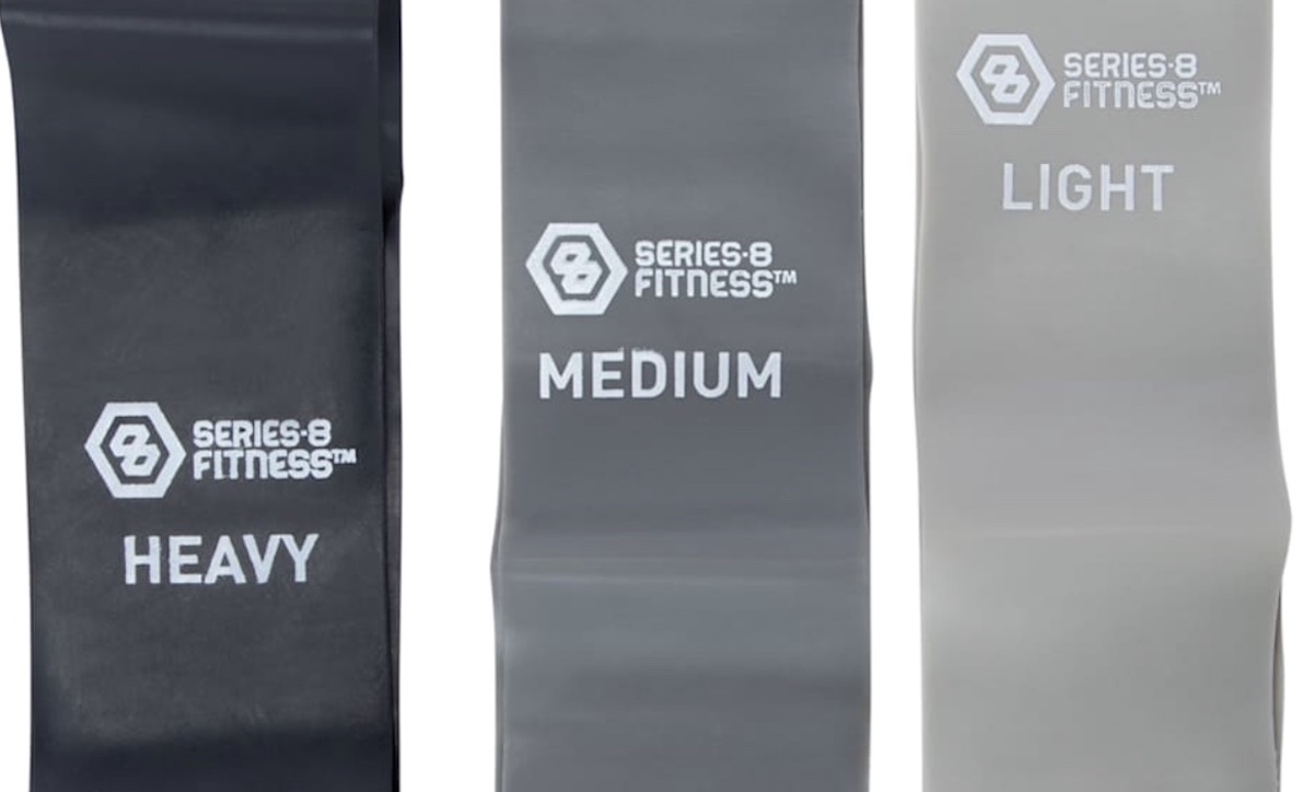 Three resistance bands labeled "HEAVY," "MEDIUM," and "LIGHT," in black, dark gray, and light gray colors, each with the Series 8 Fitness logo printed above the text.