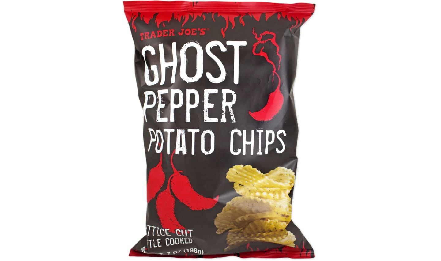 A bag of Trader Joe’s Ghost Pepper Potato Chips featuring red ghost pepper illustrations and images of crinkle-cut potato chips on a black background. The text highlights the spicy flavor, perfect for your Trader Joe's Super Bowl snack lineup.