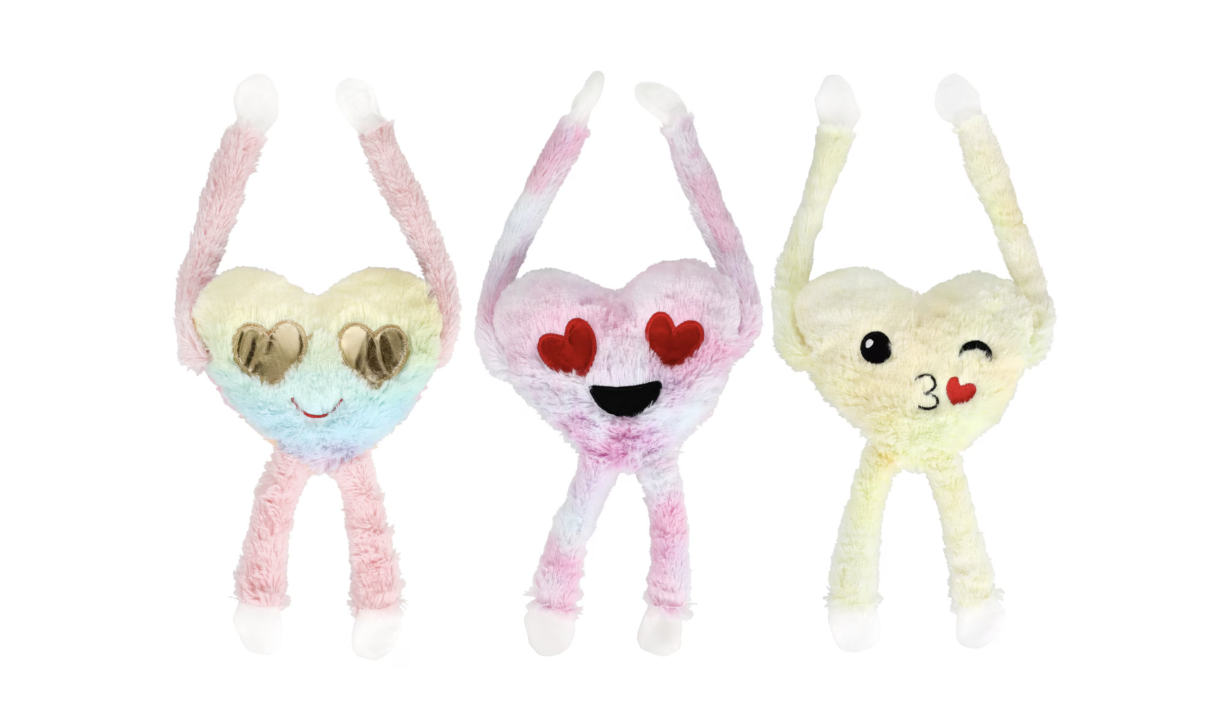 Three plush heart-shaped toys with long arms and legs, each displaying different emoji faces: sunglasses and a smile, heart eyes and a big smile, and a winking face with a kiss and a heart.