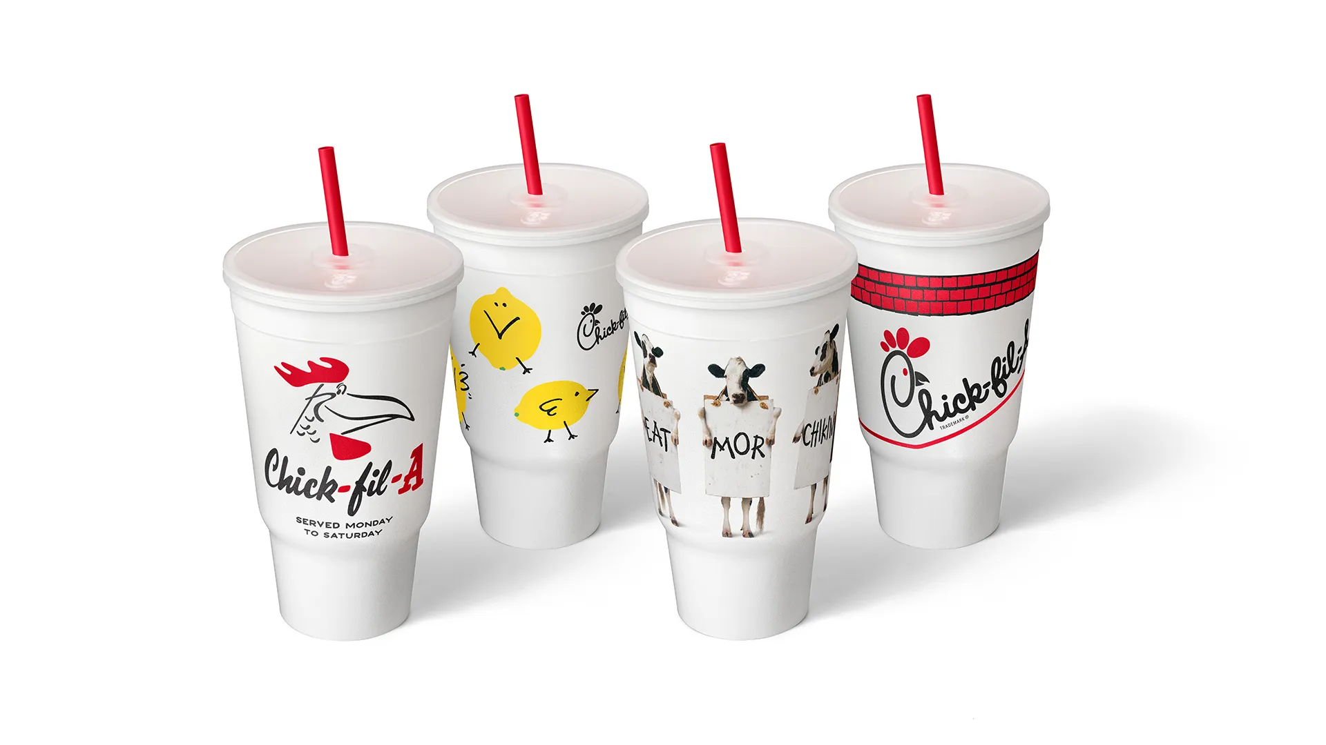 Four large Chick-fil-A cups with red straws are shown, each featuring different playful cow and chicken-themed designs and the Chick-fil-A logo on a white background.