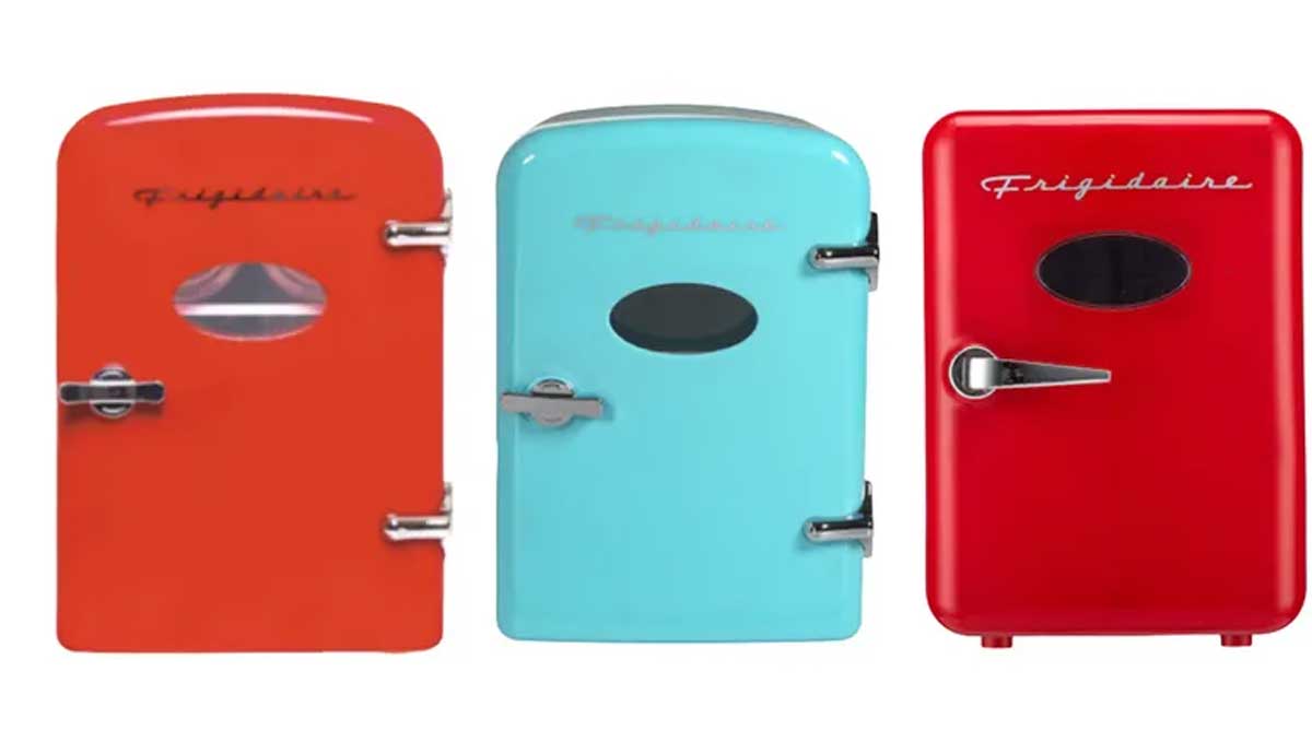 Three vintage-style mini fridges in red, blue, and bright red colors are lined up side by side. Each fridge has a small oval window and chrome handles, with a retro design and the word "Frigidaire" on the front.