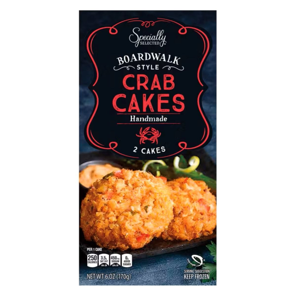 A package of Specialty Selected Boardwalk Style Crab Cakes, featuring an image of two crab cakes with sauce and greens on a black plate. The box highlights that the crab cakes are handmade and contains 2 cakes.