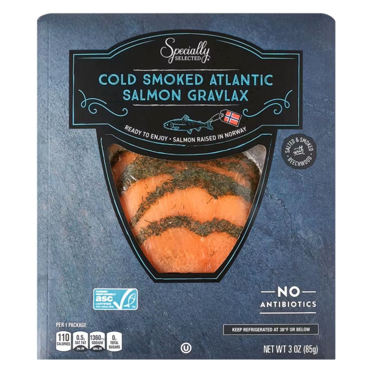 Package of Specially Selected Cold Smoked Atlantic Salmon Gravlax, showing slices of orange salmon with herbs in a clear window. The label notes “No Antibiotics” and “Salmon Raised in Norway.” Net weight is 3 oz (85g).