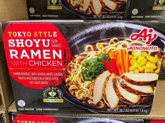 Box of Ajinomoto Tokyo Style Shoyu (Soy Sauce) Ramen with Chicken, showing a bowl of ramen noodles, sliced chicken, corn, carrots, and green onions in broth on the packaging. Text highlights 6 servings and ready in minutes.