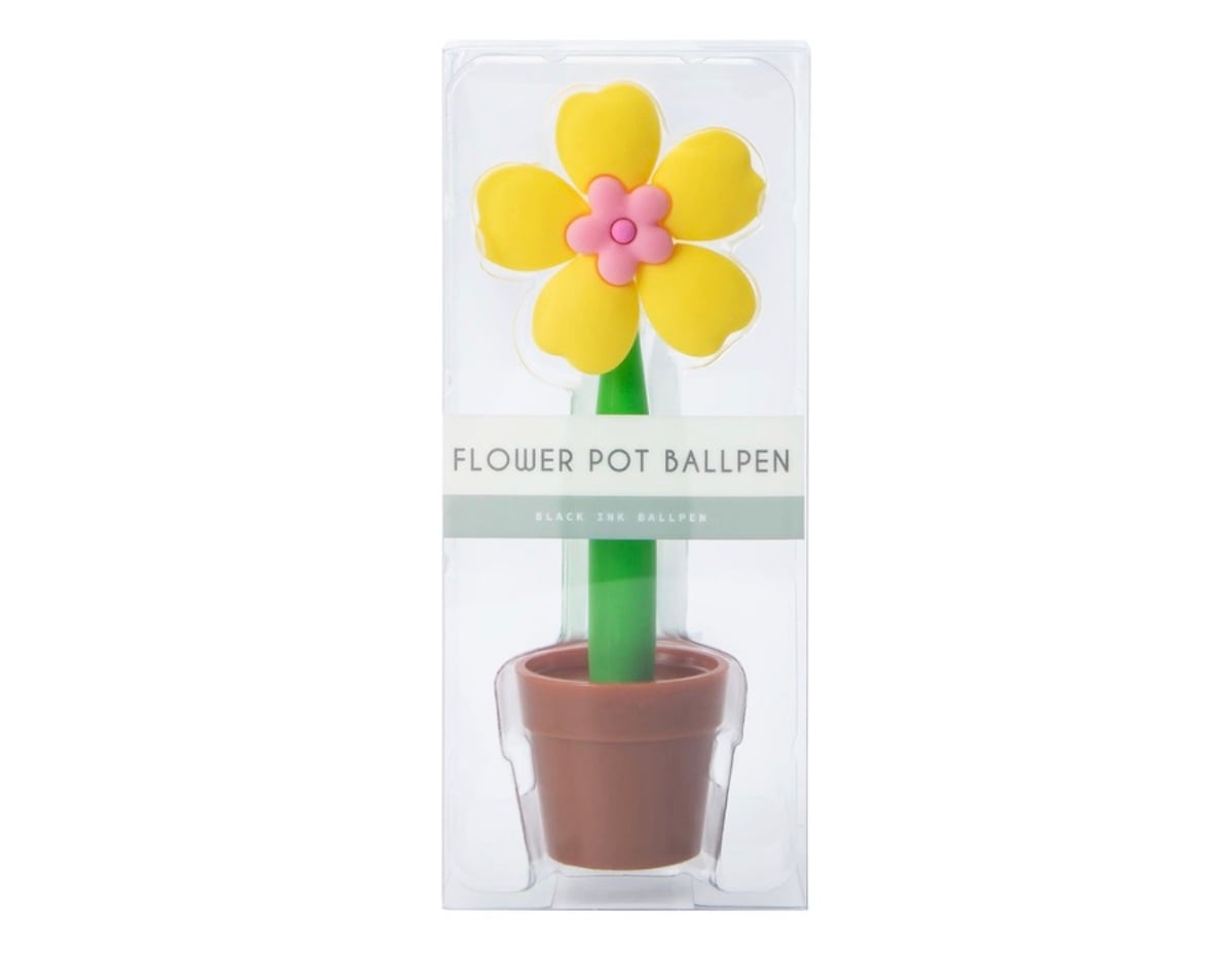 A novelty ballpoint pen shaped like a yellow flower with a pink center in a brown flowerpot, packaged in a clear plastic box labeled "Flower Pot Ballpen.