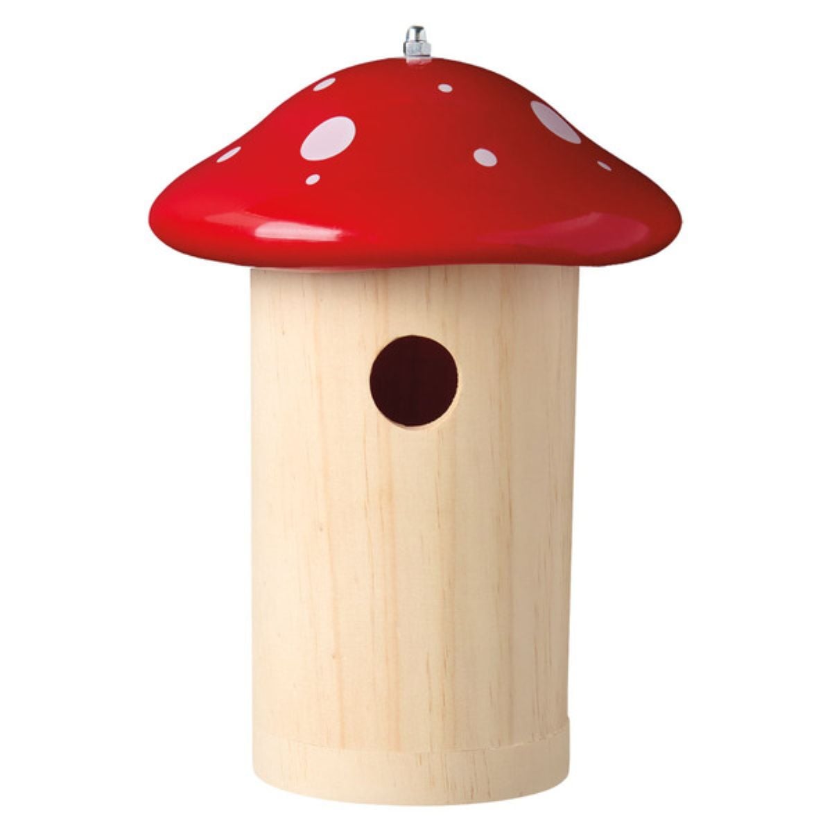 A birdhouse shaped like a mushroom, with a beige cylindrical base and a red, rounded roof featuring white spots. There is a small round entry hole on the front of the birdhouse.