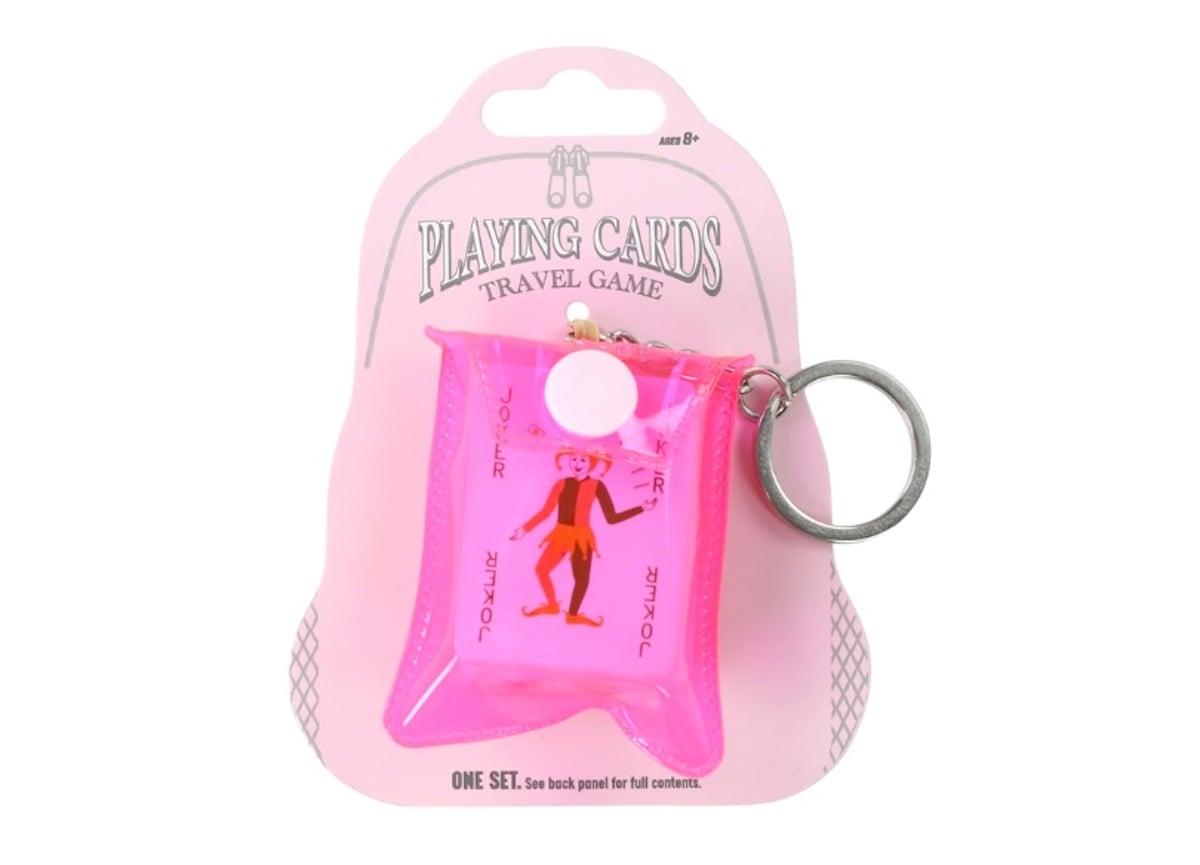 A set of playing cards in a small, transparent pink pouch with a keyring—one of our favorite five below finds. Attached to a pink backing card labeled "Playing Cards Travel Game," the pouch also features an illustration of a joker.