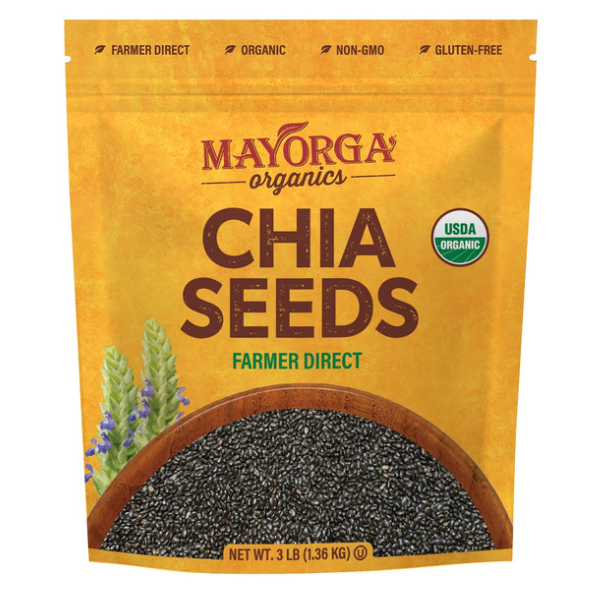 A yellow Mayorga Organics package of chia seeds labeled "Farmer Direct," "Organic," "Non-GMO," "Gluten-Free," and "USDA Organic," with an image of chia seeds and purple flowers at the bottom. Net weight: 3 lb (1.36 kg).