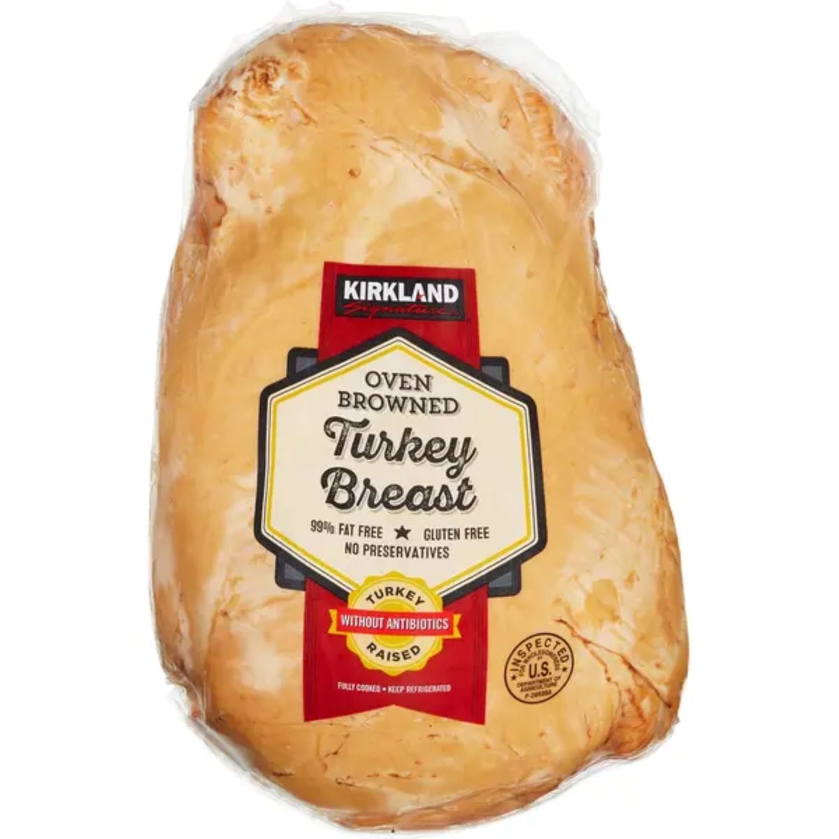 A package of Kirkland Oven Browned Turkey Breast with a red and yellow label stating "99% fat free," "gluten free," "no preservatives," and "raised without antibiotics." The turkey is fully cooked and ready to eat.