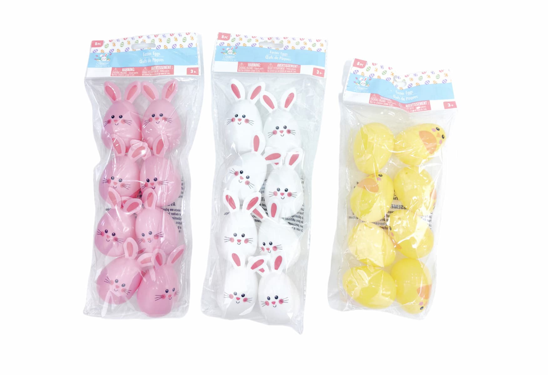 Three packs of plastic Easter eggs: pink eggs with bunny faces, white eggs with bunny faces, and yellow eggs with chick faces, all in clear packaging.