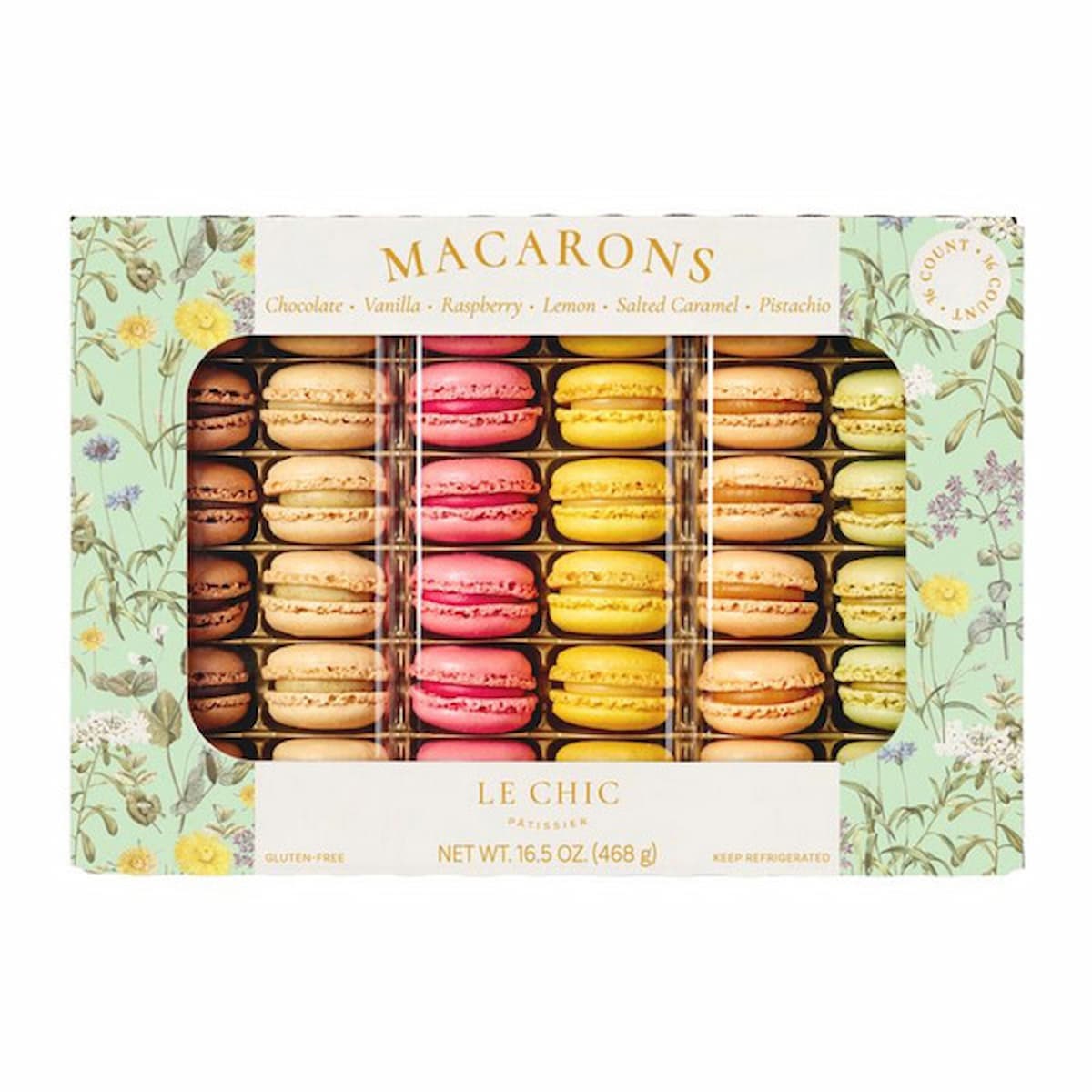 A decorative box of assorted macarons in flavors like chocolate, vanilla, raspberry, lemon, salted caramel, and pistachio, arranged in neat rows, with a floral patterned border on the packaging.