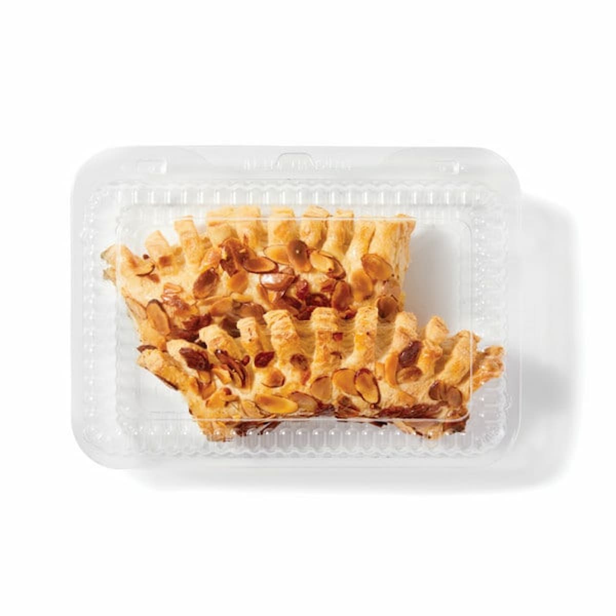 Two almond-topped pastries in a clear plastic clamshell container, viewed from above on a white background.