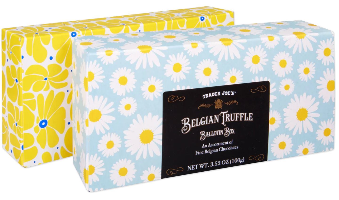 Two rectangular boxes of Trader Joe’s Belgian Truffle Ballotin Box chocolates, perfect as Trader Joe's Mother's Day gifts—one features a blue and white daisy pattern, the other a yellow floral design. The front box showcases a black and gold label.