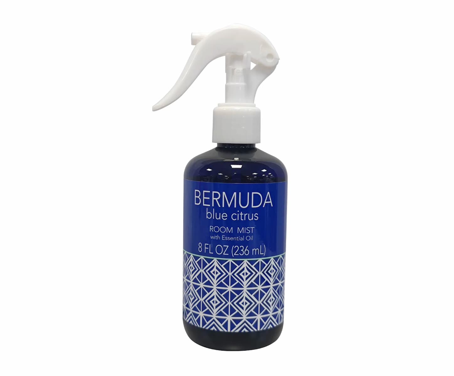 A bottle of Bermuda Blue Citrus room mist with essential oil, 8 fl oz (236 mL), featuring a blue label and geometric pattern, and a white spray trigger.